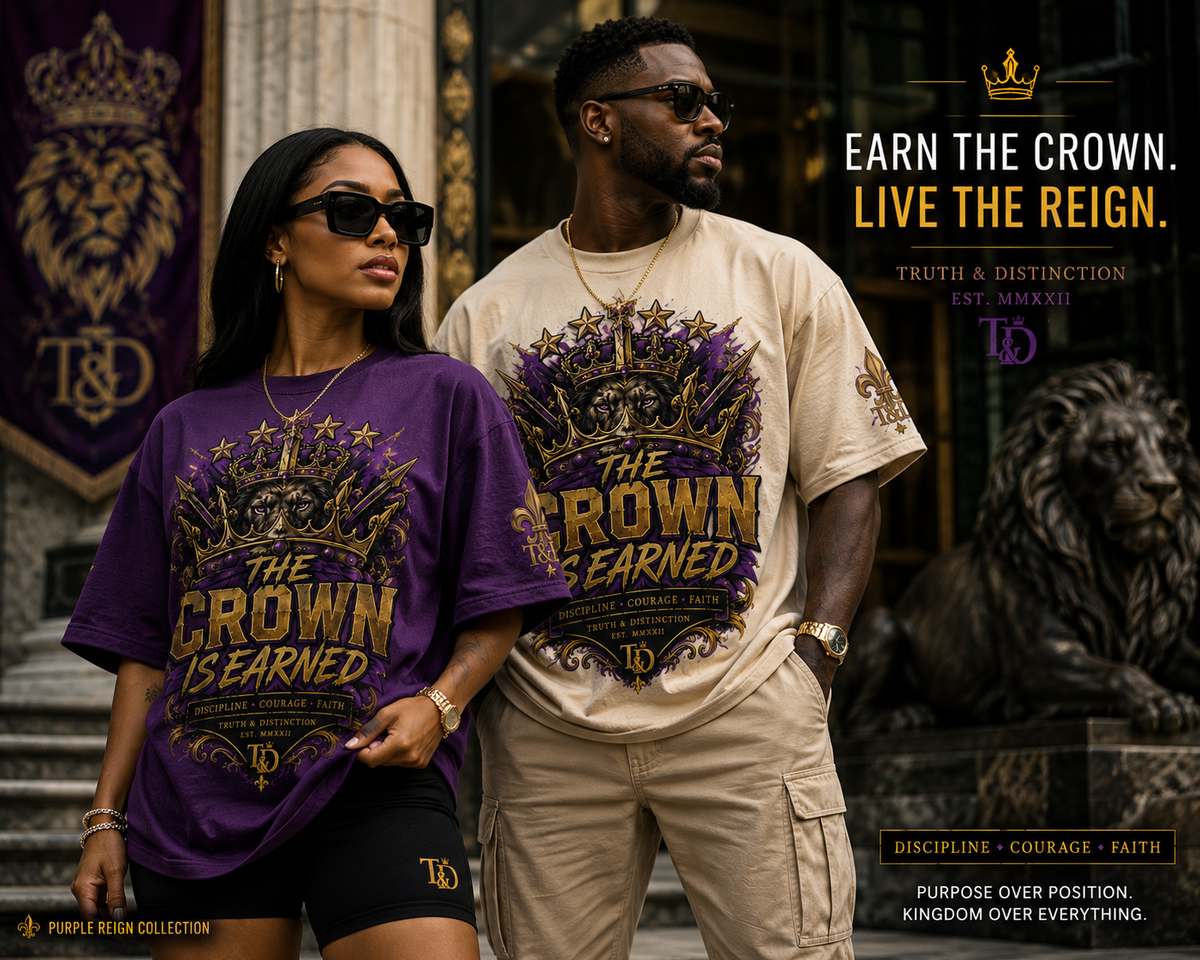 Two models wearing Truth & Distinction 'The Crown Is Earned' t-shirts in purple and beige, standing in front of a gothic stone building. The purple shirt features a purple and gold graphic, and the beige shirt features a gold and cream graphic.